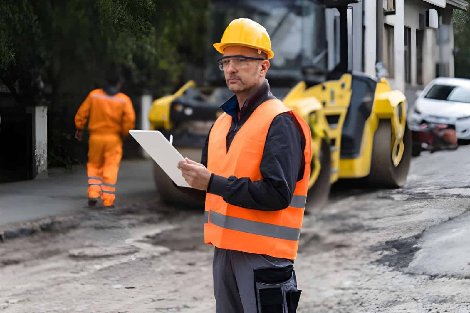 building inspection engineer checking structure clipboard